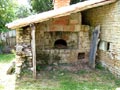 Picture of a stone wall wood oven built in 1930 in France.