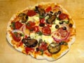 Thin base pizza with tasty crisp and crust.