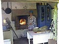 This is a picture of French country style kitchen with wood burning oven.