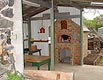 Stone block house, wine cellar and cast iron pan in wood oven..