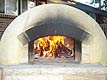 Photo of fire in igloo oven.
