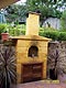 Backyard wood pizza oven built in ground.