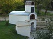 South outdoors pizza cooking oven with nice landscaping.