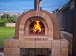 Swishy wood fired brick oven in Bonny Hills built by Manfred.