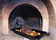 Plaster finish applied to outdoors brick oven.