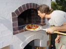 Pizza paddle used for placing pizzas in and out from the wood ovens.