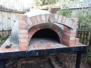 Spherical brick oven with glass tubes